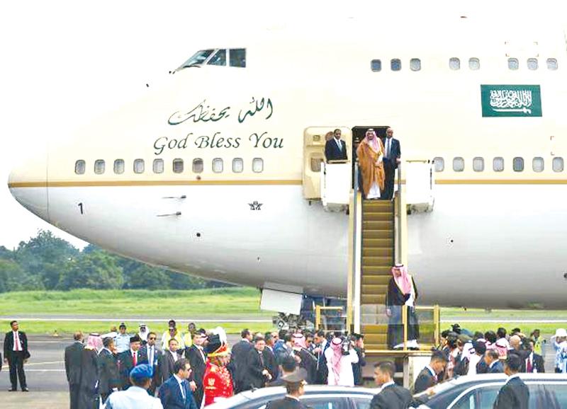 Saudi Arabia’s King Salman bin Abdul Aziz (front) arrives at Halim airport in Jakarta
