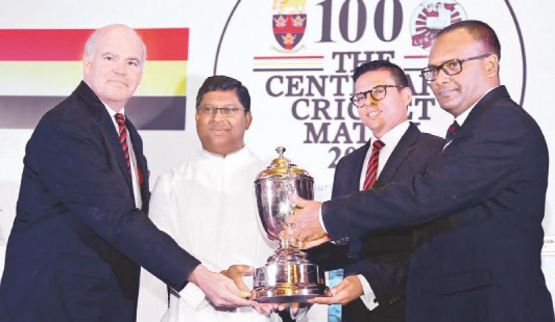 Asela Herath (OACW)  and  Nilantha  Ratnayake ( President Trinity CF) handing over the  John Halangoda  Challenge  Trophy to  the two   principals Andrew Fowler- Watts (Trinity) and Rev.  Fr. Henry  Bernard  Wijeratne ( SACK) 