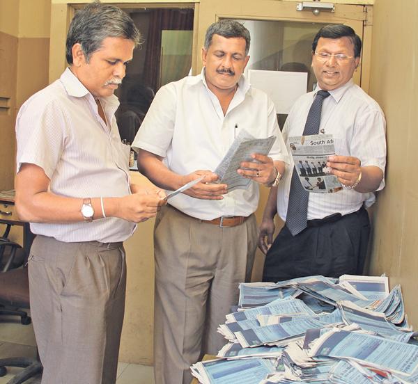 Picking the  lucky winners. From left. Kapila Ajith Kumara (Head  Of  IT ANCL), Kamal Wijesuriya ( DGM Printing  And Maintenence ANCL) and Narada Sumanaratne( DGM Human Capital) picking  the  lucky  coupons  at  the  end  of  the  third  week  count.
