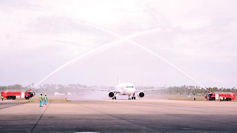 The new plane receives the traditional water salute