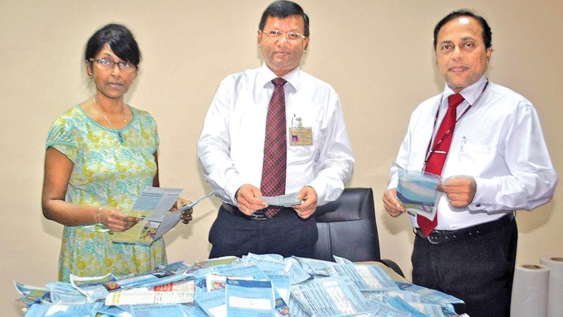 Picking the winners. From left. Chandani Jayatileka ( Associate Editor Sunday Observer), Narada Sumanaratne ( DGM Human Capital ,ANCL ), and Waruna Mallawarachchi ( DGM Advertising) picking the winning coupons.    