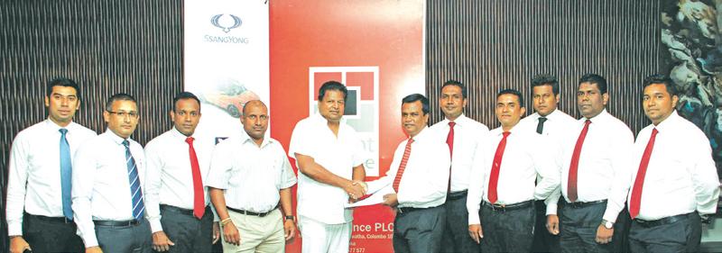 Ideal Automobiles (Pvt) Ltd team members along with Aravinda De Silva (Deputy Chairman –Ideal Automobiles), Nalin J. Welgama (chairman – Ideal Automobiles), Mayura Fernando (CEO of Orient Finance PLC), NilanthaJayanetti (Snr. AGM of Orient Finance PLC), and rest of the Orient Finance PLC Team.