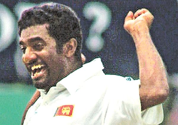  AFP PHOTO/  Sena VIDANAGAMA Sri Lankan off spinner Muttiah Muralitharan celebrates claming his 500th Test wicket at the Asgiriya stadium