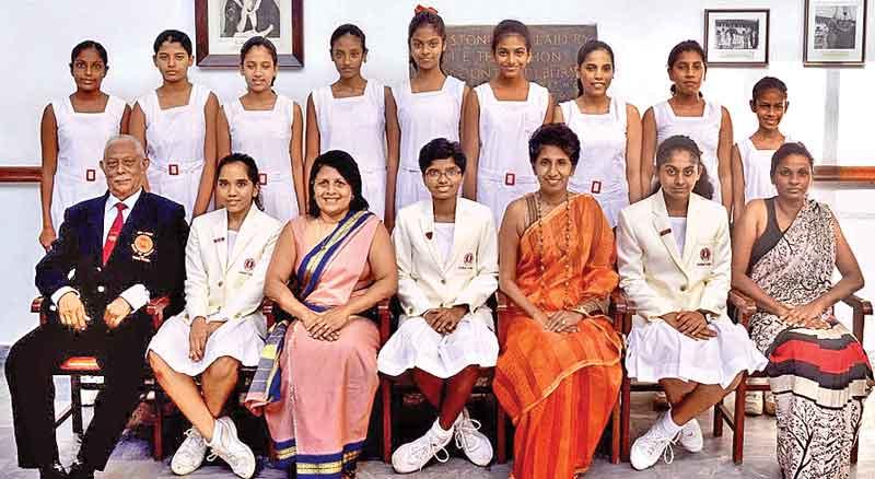 Seated: (from left): N.H. Perera (Coach), Anoushka de Silva (vice-captain), Ms. Deepika Dassanaike (Vice Principal), Upamali Rodrigo (Captain), Ms. Eesha Speldewinde (Principal), Minali Siriwardena (vice-captain), Pathmi Ratnayake (Teacher-in-charge). Standing: (from left): Dinethi Hapudeniya, Manesha Siriwardena, Ayla Chitty, Jithara Warnakulasuriya, Shalomie Rajkumar, Hadasha Randunubandara, Zeenath Hassim, Amrah Mohammad, Ashcharya Ranatunga.