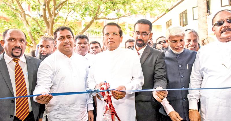 President Maithripala Sirisena opens the block of Oddamavadi Central College. Education Minister Akila Viraj Kariyawasam, Eastern Province Chief Minister Ahmed Nazeer Zainulabdeen and officials look on.