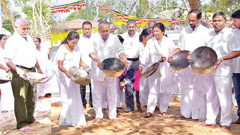 BOC Chairman Ronald C. Perera and staff take part in the  sand strewing ceremony