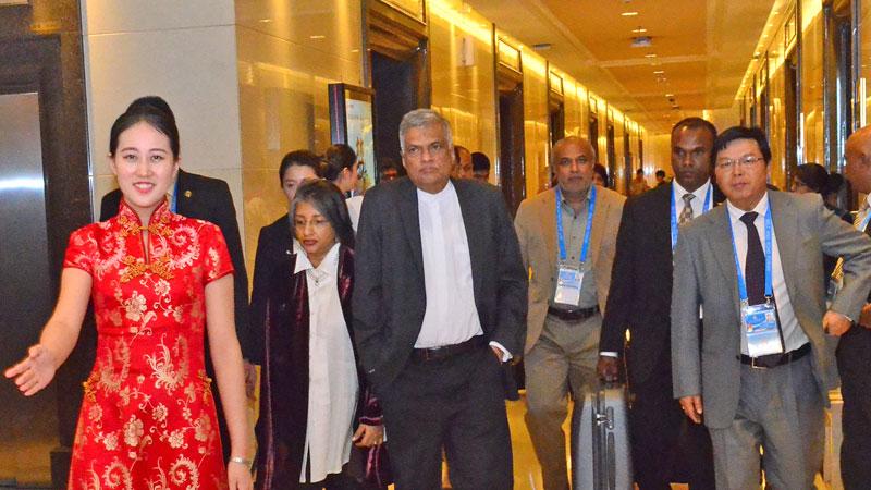 PM Ranil Wickremesinghe and Prof. Maithree Wickremesinghe being welcomed at the Capital International Airport in Beijing last evening. The PM arrived in Beijing to take part in the ‘One Belt, One Road’ summit.