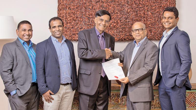 Prof. Mohan Munasinghe (third from right) and Hilmy Cader (second from right) after signing the agreement, with Sanith de Silva Wijeyaratne (CEO), Fazal Fauz (Director) Subramaniam Eassuwaren,