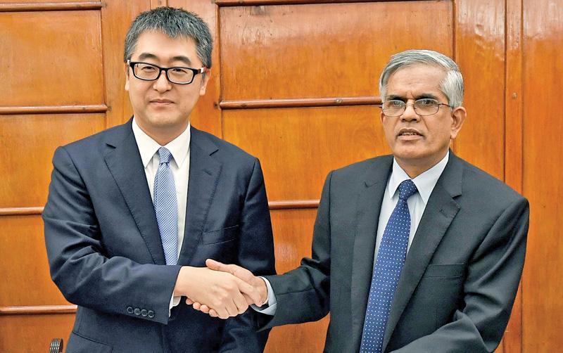 ADB Country Director, Sri Widowati greets Secretary, Finance Ministry, Dr. R.H.S.Samaratunga