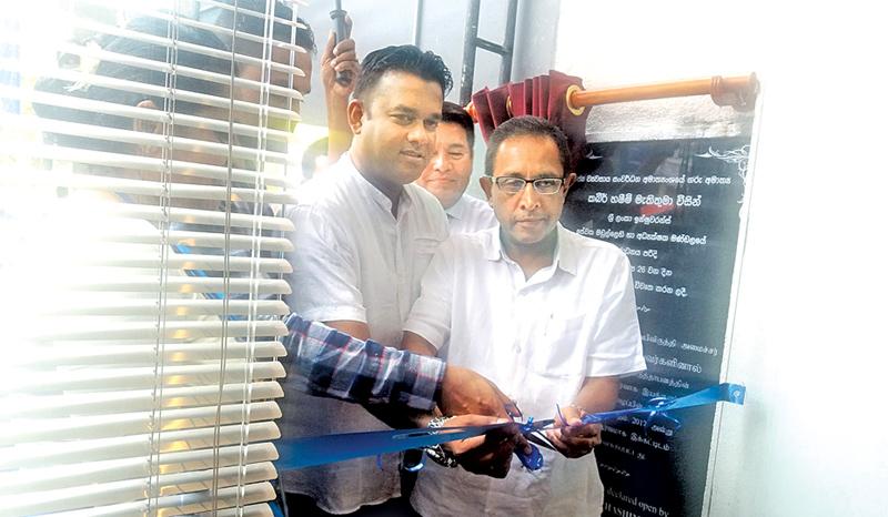 Minister Kabir Hashim opens the new branch office.