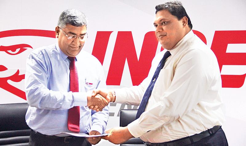 Chairman of National Apprentice and Industrial Training Authority, Dr. A.U.C. Athukorala exchanging the agreement with CEO of Insee Cement, Nandana Ekanayake (on left).