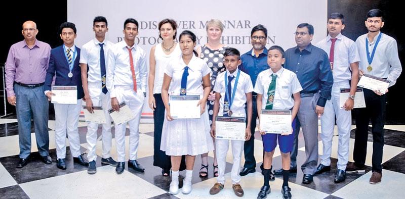 Award winners from the Student Category : (Back Row – from Left: Ajith Ratnayaka, Managing Director of the Palmyrah House; Heshan Kaushalya – Silver, S. Cavinsan – Merit; Vijayakumaran Thivakar – Merit; Amena Arif, IFC Country Manager for Sri Lanka and Maldives; Libuse Soukupova, Head of Cooperation of the EU Delegation to Sri Lanka and the Maldives; Hiran Weliwitigoda, President of the Photographic Society of Sri Lanka; Mr. Thayanathan, Director, Palmyrah House; A. Antoneyo Anastan – Merit; Akshay Sattruka