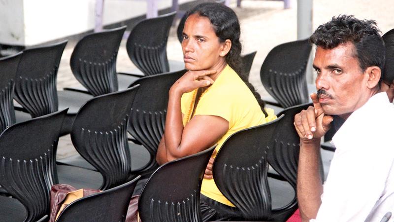 Patients wait eagerly at the OPD section of the National Hospital on Friday. GMOA called off their strike last morning after a meeting with the President. (Picture by Sudam Gunasinghe)