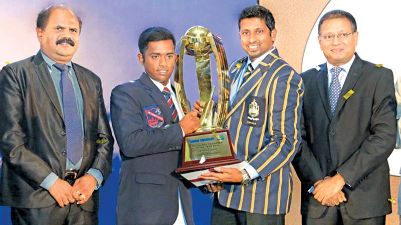Flashback: When Charith Asalanka of Richmond College, Galle won the Observer-Mobitel Schoolboy Cricketer of the Year award for the first time. Picture shows Asalanka receiving the award from former Sri Lanka Test Cricketer Russel Arnold who was the chief guest at the award ceremony held at Galadari Hotel in 2015. Also in the picture are Chairman and Managing Director of Lake House (ANCL) Kavan Ratnayake (extreme right) and Chairman of Sri Lanka Telecom Mobitel P.G.Kumarasinghe (extreme left). Picture by Lal