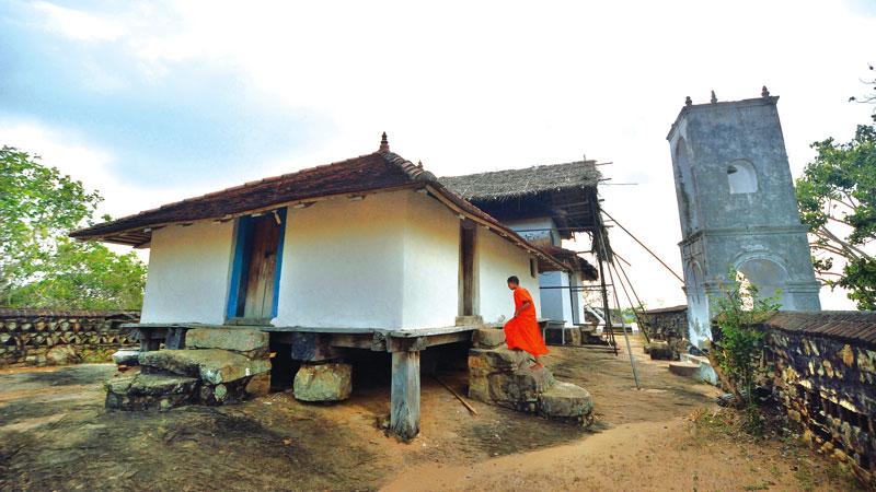 Bihalpola ‘Tampita Vihara’ built on wooden beams on a rock boulder stands majestically on the summit of the hill