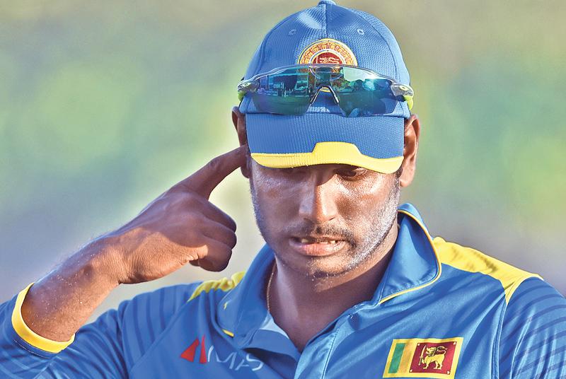 Sri Lankan cricket captain Angelo Mathew reacts their defeat on the first one-day international (ODI) cricket match between Sri Lanka and Zimbabwe at the Galle International Cricket Stadium in Galle on June 30, 2017. / AFP PHOTO / ISHARA S. KODIKARA