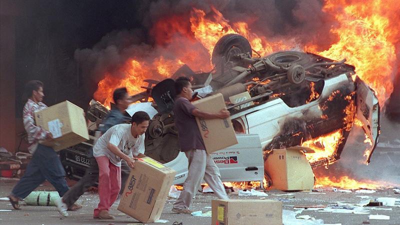 Burning and looting by people in Indonesia in 1997.  FILE PIC: WWW.BBC.CO.UK 