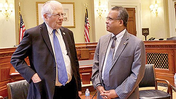 Sri Lanka Ambassador in the USA, Prasad Kariyawasam in conversation with a US statesman.  