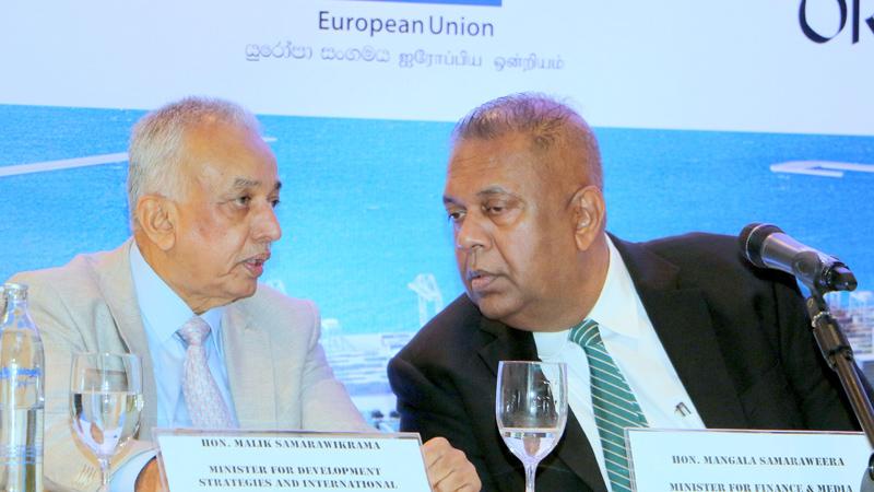 Minister of Development Strategies and International Trade, Malik Samarawickrama with Minister of Finance and Mass Media, Mangala Samaraweera. PICTURE BY SAMAN SRI WEDAGE