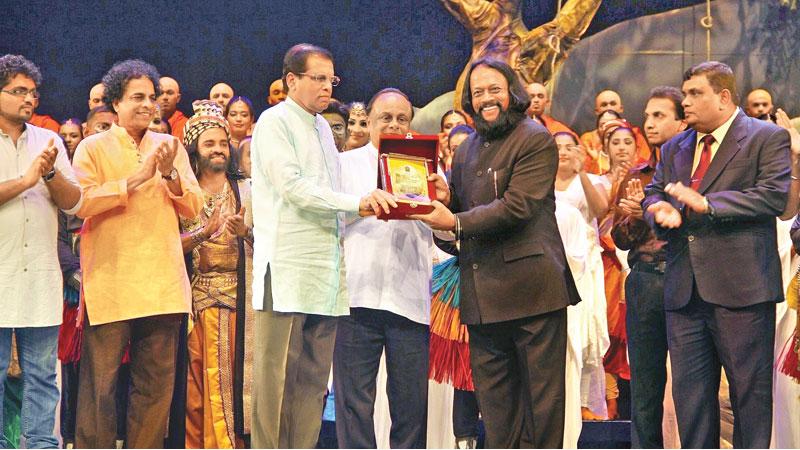 Chief Guest President Maithripala Sirisena presenting a felicitation award to Director Prof Ariyaratne Kaluarachchi    