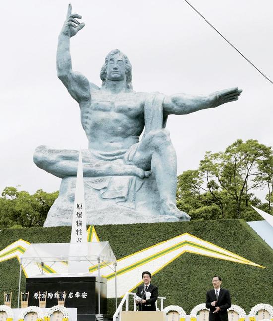    Prime Minister Shinzo Abe speaks in front of a memorial statue in Nagasaki during a ceremony to mark the 72nd  anniversary of the atomic bombing of the city. Pic: KYODO   