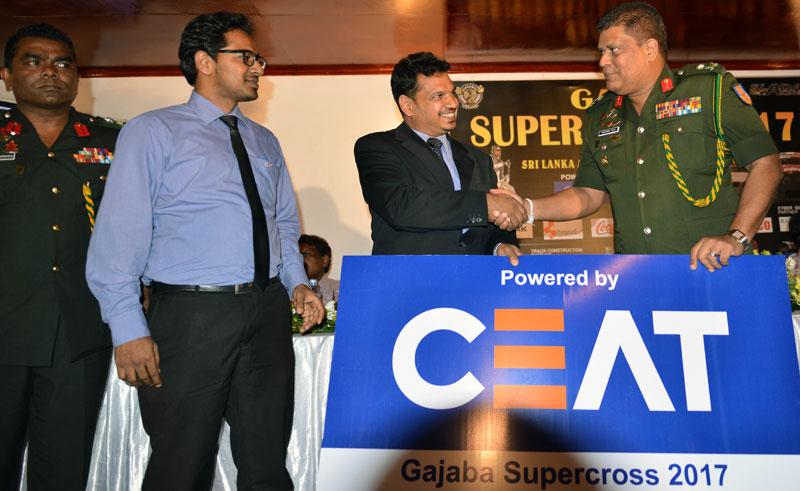 Major General Shavendra Silva the chairman of the Gajaba Supercross 2017 Organizing Committee receives the main sponsor ship from Bishri Latif of CEAT Kelani Tyre Lt. Also in the picture are for left Col.Mahinda Rajapaksa and Tharindu Mihiraka. Picture by Rukmal Gamage.     