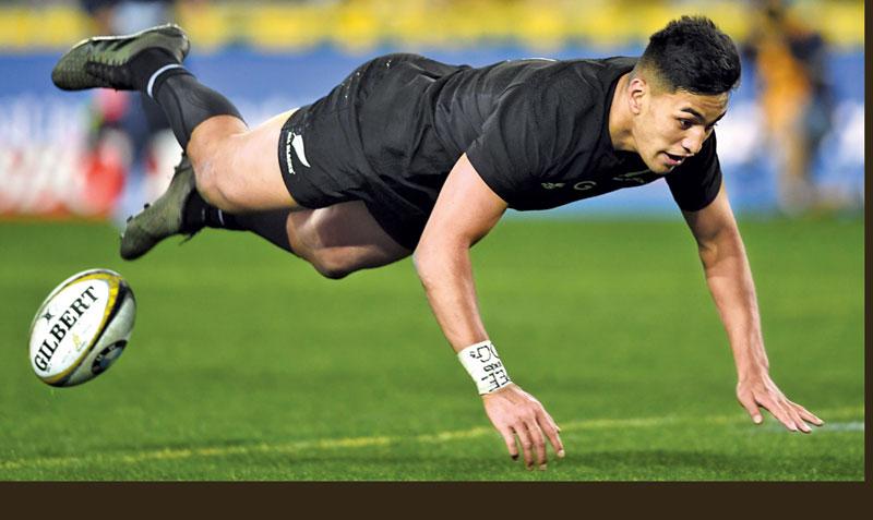 New Zealand’s wing Rieko Ioane scores a try during the Rugby Championship test match between Australia and the New Zealand All Blacks in Sydney on August 19, 2017. -AFP