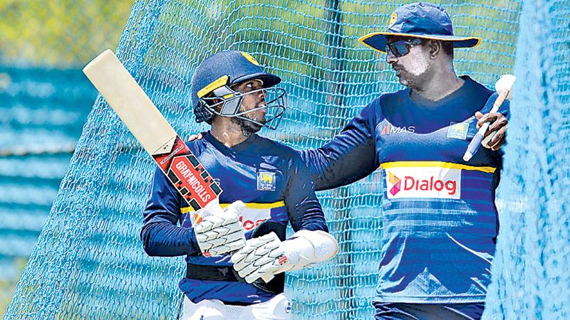 Kusal Mendis has a word with Sri Lanka one-day batting coach Avishka Gunawardene during net practice.  AFP