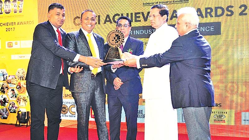  President Maithripala Sirisena presents the National Gold Award (Extra-Large Category- Service Sector) to SAW Engineering Chairman/ Managing Director Dr. Athula Jayarathna and Group General Manager Bandula Jayarathna.   