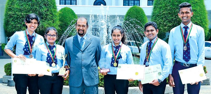 The winning IHS students with Principal Ravindra Magedera    