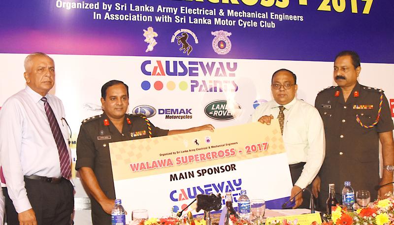 General Manager of Causeway Paints Ltd. V Kiritharan hands over the sponsorship cheque for the Walawa Supercross -2017 to Col. Commmadant Brigadier Duminda Sirinaga of SLEME. Also in the picture are Ananda Jayasekera, President SLMCC and Center Commadant of SLEME Saman Fonseka. Picture by Rukmal Gamage