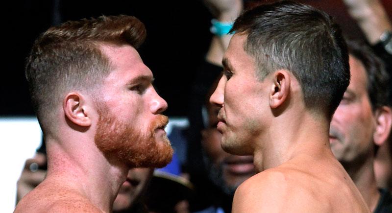Boxers Canelo Alvarez (L) and Gennady Golovkin (R) face-off during their weigh-in at the MGM Grand Hotel & Casino on September 15, 2017 in Las Vegas, Nevada. Alvarez will challenge WBC, WBA and IBF middleweight champion Gennady Golovkin for his titles at T-Mobile Arena on September 16th in Las Vegas.  AFP PHOTO / John GURZINSKI