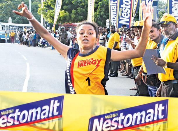 11.2 km Mini Marathon Girls winner R. D Kalpani at the finish line