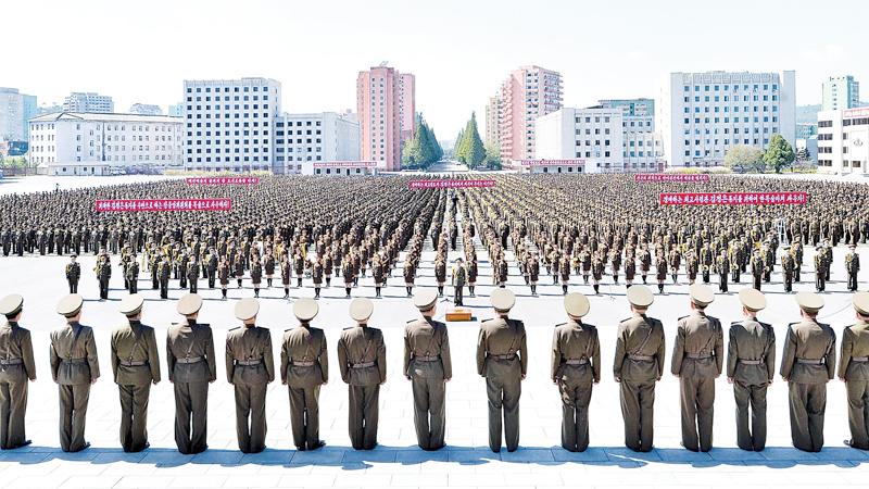 Military personnel take part in an anti-US rally in Pyongyang, North Korea.   Pic: STR/AFP/Getty Images   