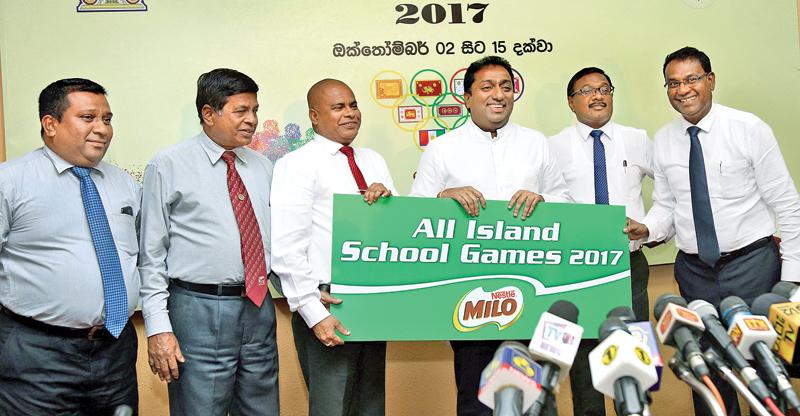 Minister of Education Akila Viraj Kariyawasam receives the sponsorship for the All Island School Games from Vice President Nestle Lanka Ltd. Bandula Egodage (extreme right). Also in the picture are from left S. Weerasinghe, Sunil Jayaweera (Special Advisor Physical Training & Sports), Sunil Hettiarachchi (Ministry Secretary) and A. Senani Hewage (Asst. Secretary) picture by Rukmal Gamge 