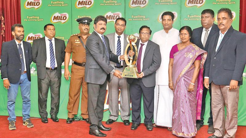 Nestle Lanka Sales Manager (North) S. Raveendran hands over the Cup to N.Vethanayakan G.A Jaffna at the Media briefing. Also in the picture are from left B.Mukunthan Football Coach (Jaffna), Senior Manager -Activation Nestle Lanka PLC Sanjeewa Wickramasinghe, Gamini Hewawitharana H.Q.I Jaffna, Police, Bandula Egodage Vice President- Corporate Affairs Nestle Lanka PLC, E.Arnold Sports Coordination Northern Province, P. SelvinAdditioal Provincial Director of Education Northern Province, K.Vijitharan DSO Jaffn