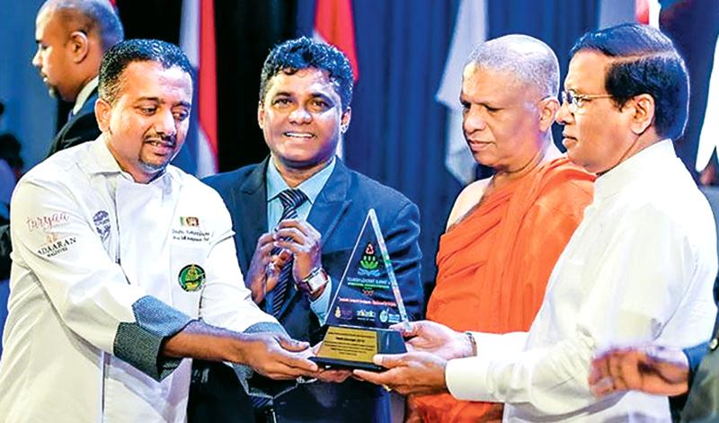 Chef Dimuthu receiving his award from President Maithripala Sirisena.