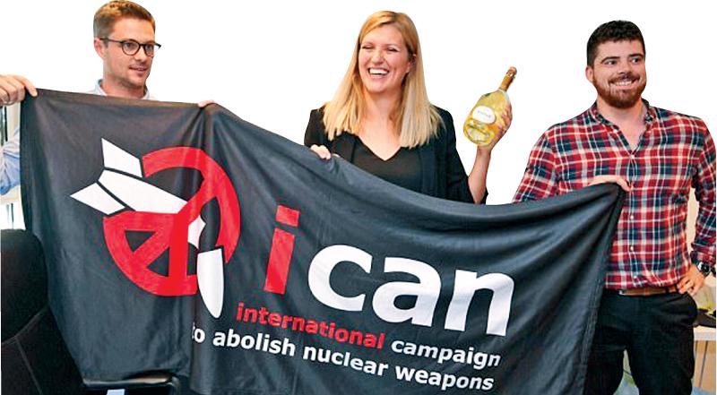 Nuclear disarmament group ICAN coordinator Daniel Hogstan, executive director Beatrice Fihn (centre) and her husband Will Fihn Ramsay after ICAN won the Nobel Peace Prize for its decade-long campaign to rid the world of the atomic bomb    