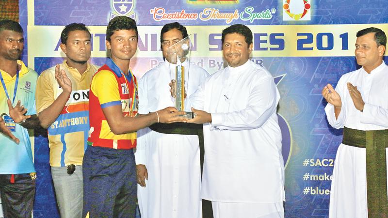 Captain of Thurstan College receiving the coveted Antonian Sixes Trophy from State Minister of Defense Ruwan Wijewardena, who was the chief guest on the final day of the tournament. 