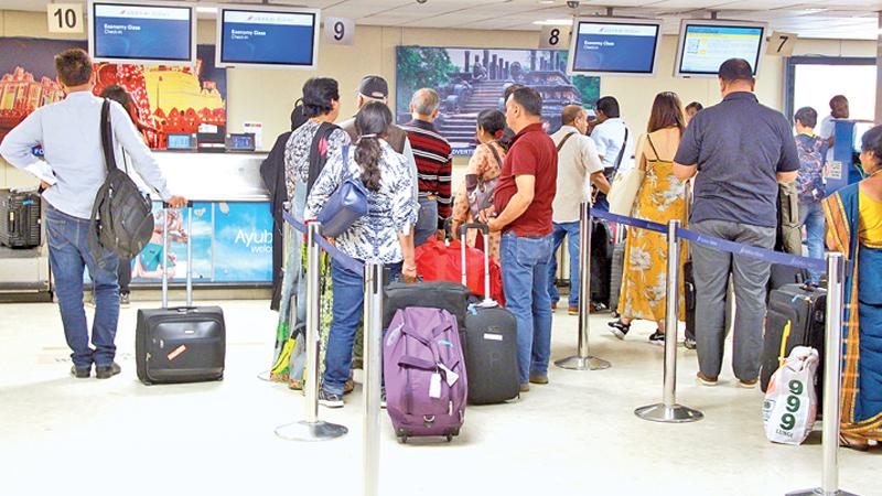 Passengers waiting to board the flight Pix: Kalum Liyanage