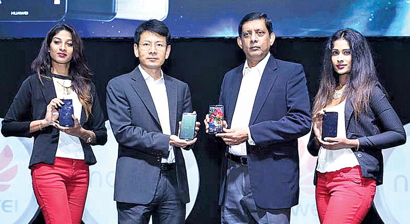 Huawei Sri Lanka CEO Shunli Wang and Singer Sri Lanka PLC Marketing Director Kumar Samarasinghe introduce the Huawei nova 2i.