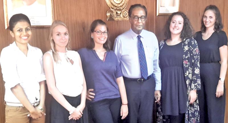 Minister of Prison Reforms D. M. Swaminathan (third from right) with German female social workers Nastasja Berwing, Miriam, Bianca Vondenhoff, Nina Boesser with a Sri Lankan social worker. 