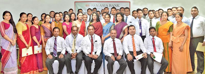 Recipients of Long Service Awards with CEO and Head of Human Resources of Pan Asia Bank.    