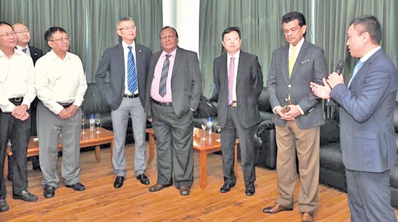Guests and senior officials of CICT at the commissioning of the  E-RTGs. (From right): Ray Ren, CEO of CICT, Dr Parakrama Dissanayake,  Chairman SLPA, Chen Jiaqing, Managing Director ZPMC International Group,  P. G. Dassanayake, Vice Chairman SLPA, Hang Tian, Chairman of CICT, Ma  Yong, General Manager CMPort, Raymond Mu, CFO of CICT and Zhang Yihe,  General Manager Haiqin.   