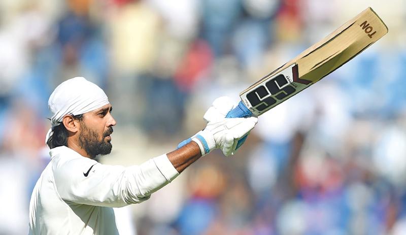 Indian opener Murali Vijay celebrates his hundred on the second day of the second Test against Sri Lanka at the Vidarbha CA stadium in Nagpur on Saturday. AFP