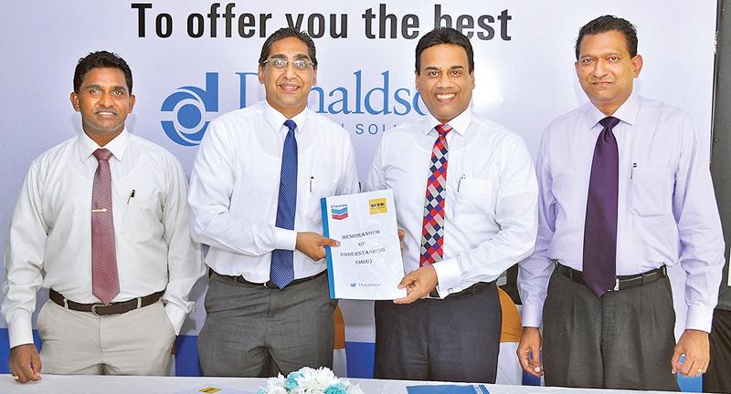 (L-R) Aravinda Jayasekara, General Manager Product Support Services and Riyad Ismail, CEO of UTE; Kishu Gomes, CEO/MD and Bertram Paul, General Manager, Sales of Chevron Lubricants Lanka PLC, soon after signing the MOU.   