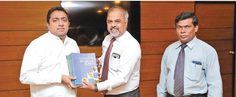 MBD’s Sri Lanka Country Manager Jayampathy Arambepola hands over the books to Minister of Education Akila Viraj Kariyawasam. Director of Science of the Ministry of Education, Mr. Wipulasena is also in the picture.
