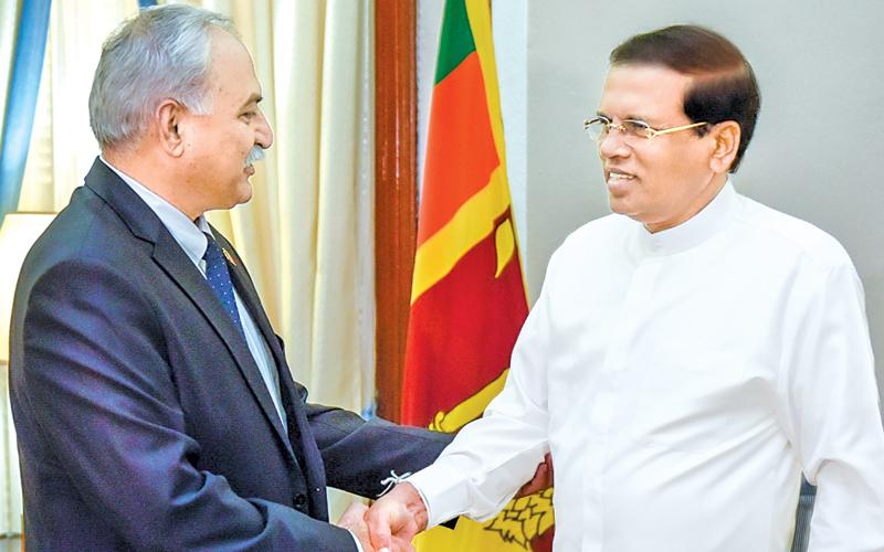 High Commissioner of Pakistan Dr. Shahid Ahmad Hashmat shake hands with President Maithripala Sirisena