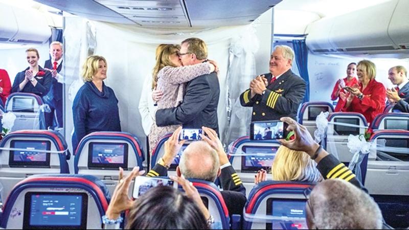  Gene and Holly share their first kiss as husband and wife aboard the final 747 passenger flight in the U.S.