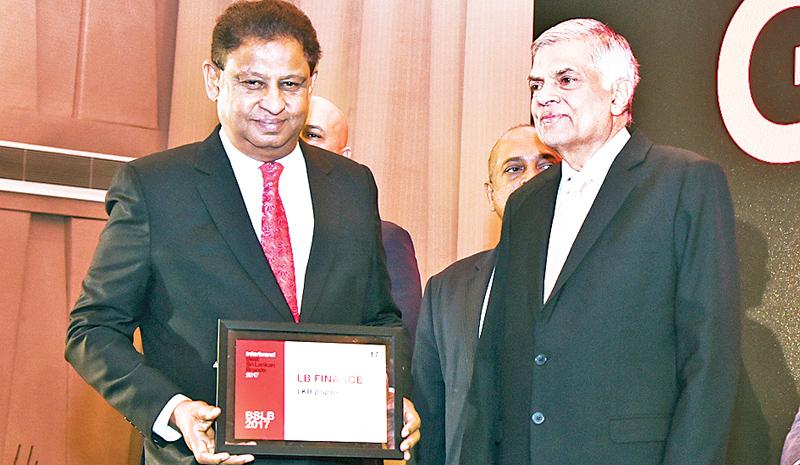 Managing Director,  LB Finance, J. A. S. Sumith Adhihetty receives the award from Prime Minister Ranil Wickremesinghe